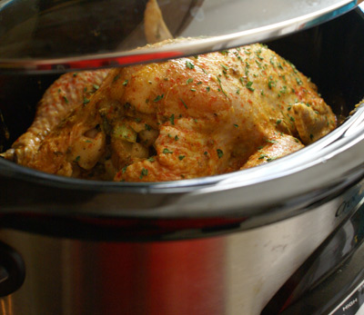 Put the chicken, stuffed, in the crock pot.  It will create it's own sauce.