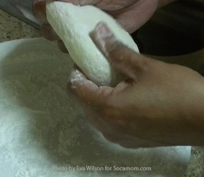 Knead and fold dough into a ball.