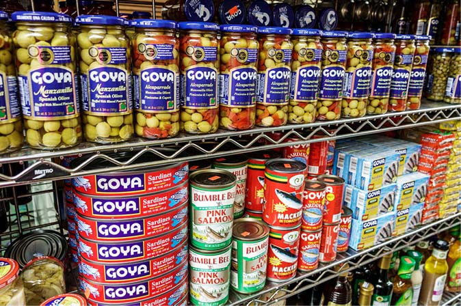 cans of coya products on a grocery store shelf